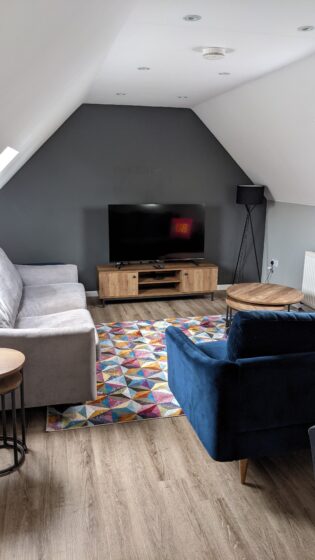 Upstairs TV area in Dream Land Cottage AirBnB Margate