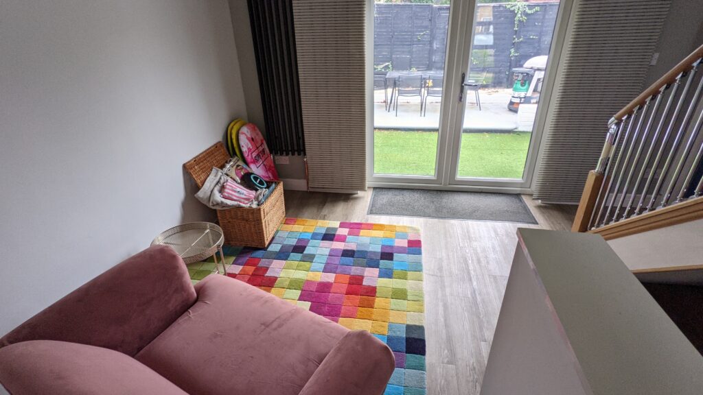 Love seat and pixel rug with view to garden in AirBnB Margate.