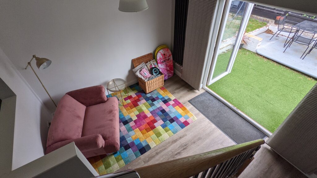 View from stairs down into hallway in AirBnB Margate.