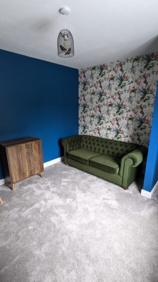 Sofa in The Snug in Dream Land Cottage AirBnB Margate